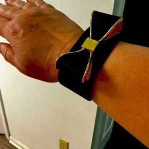 Black and gold bracelet (leather ) with a bow